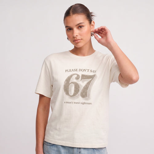 Kiksy cream funny mum t-shirt featuring the slogan Please don't say 67 a mum's worst nightmare, modelled by a woman.