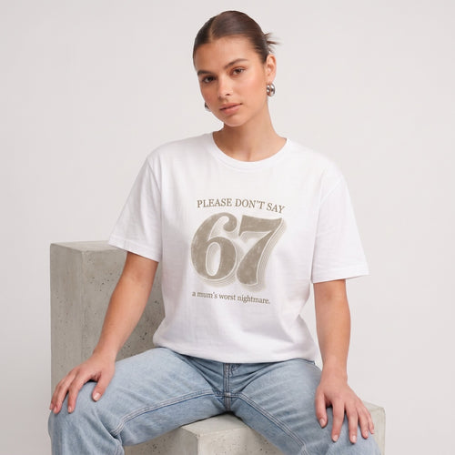Kiksy white funny mum t-shirt featuring the slogan Please don't say 67 a mum's worst nightmare, modelled by a woman.