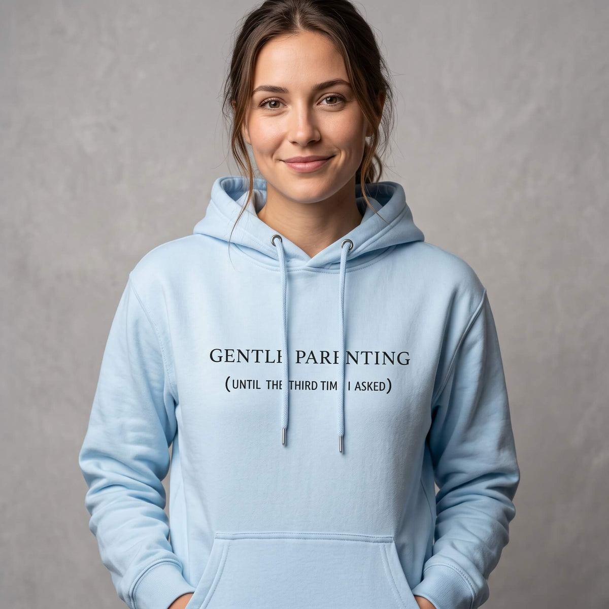 Kiksy sky blue organic cotton hoodie for women featuring gentle parenting slogan printed on front.