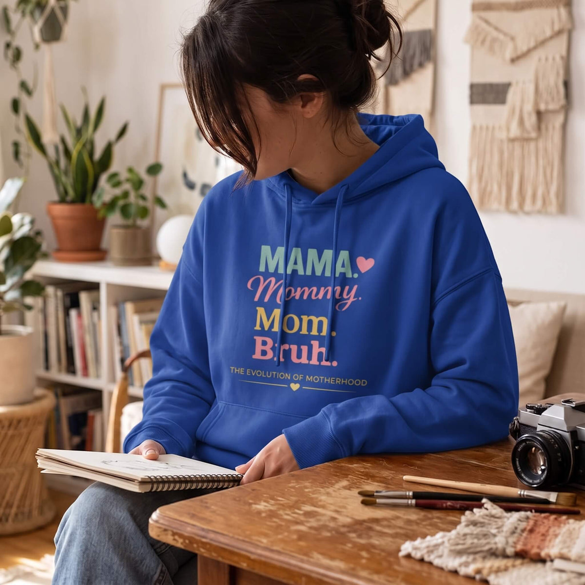 Kiksy royal blue mom hoodie featuring the print Evolution of Motherhood Mama Mommy Mom Bruh on soft fleece fabric.