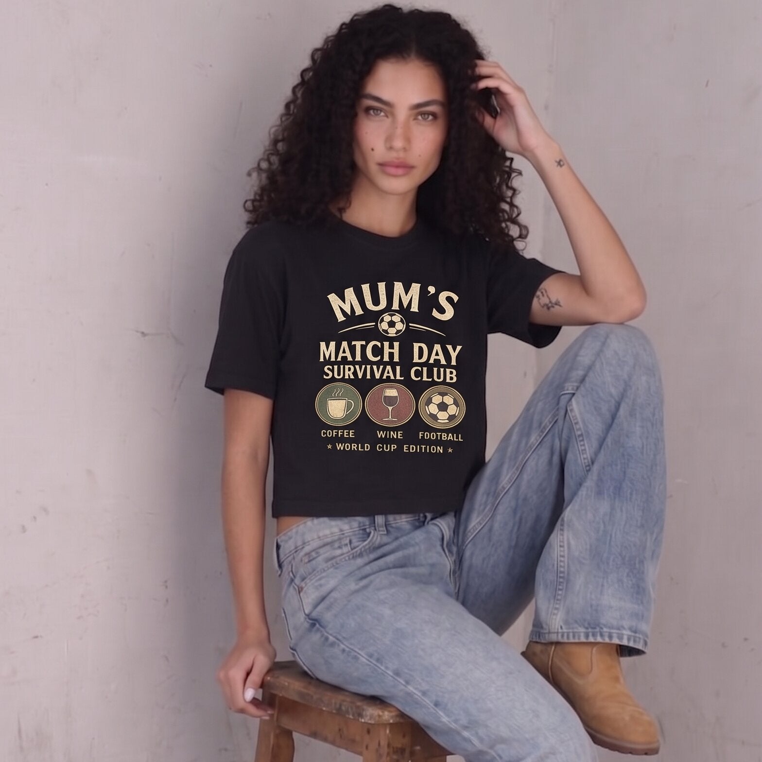 Kiksy black cropped t-shirt for women featuring a graphic print that reads Mum's Match Day Survival Club.