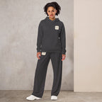 Kiksy Mama matching tracksuit set in graphite grey featuring a fleece hoodie and wide-leg joggers on model from graphite-matching-set-mama-hoodie-side.jpg